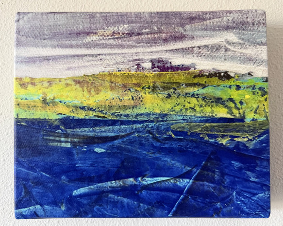 Photo of canvas print of original abstract landscape painting on canvas with deep blue ocean with turquoise line waves and purple and muted white sky, with yellow-green abstract land between them.