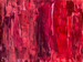original abstract painting of mostly horizontal uneven lines of many shades of red, and with pinks and purples