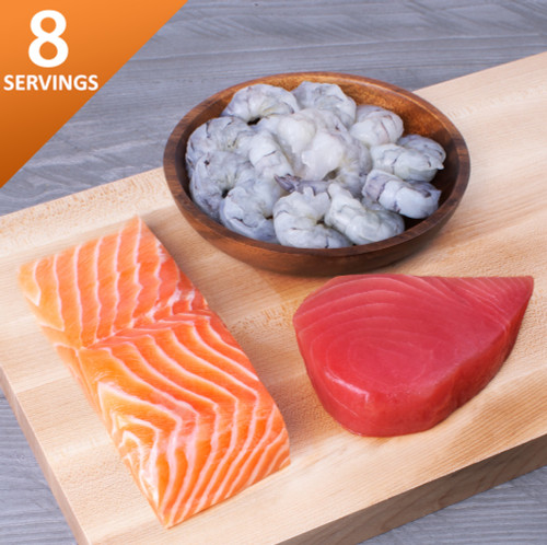 Brunos Box Salmon tuna shrimp on a cutting board