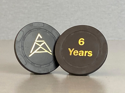 Six year, black anniversary chip with the CMA logo on one side and "6 Years" embossed on the other.