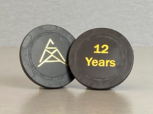 Twelve year, black anniversary chip with the CMA logo on one side and "12 Years" embossed on the other.