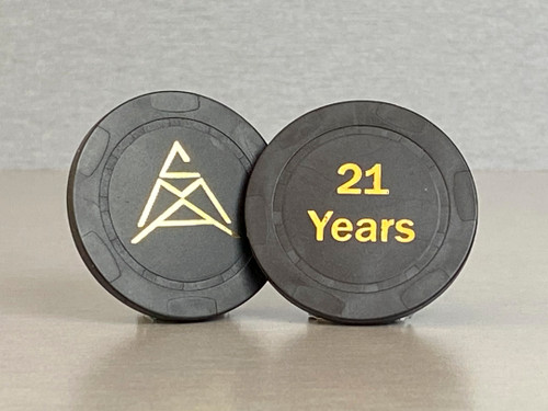 Twenty-one year, black anniversary chip with the CMA logo on one side and "21 Years" embossed on the other.