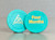 Four month, aqua recovery chip with the CMA logo on one side and "Four Months" embossed on the other.
