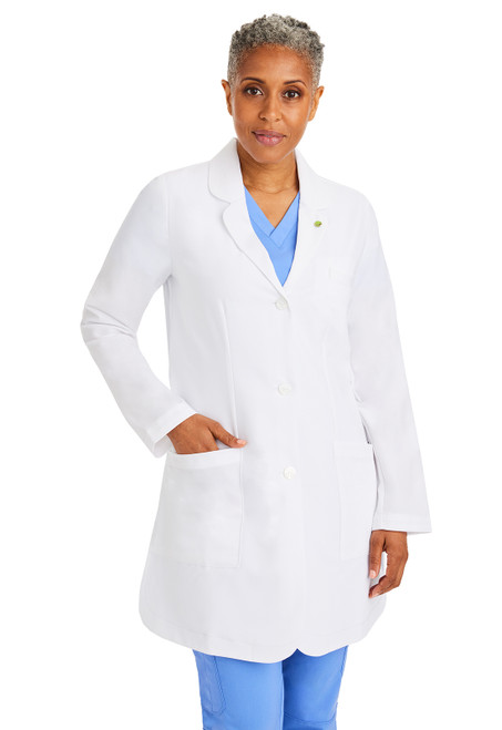 Left view of the HH White Coat Fiona Labcoat: mid-length, 4-way stretch fabric, side/back vents for mobility, four pockets, polished look. Essential for medical uniforms and nurse scrubs.