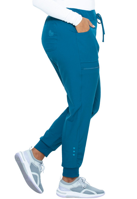 Low-rise, tapered joggers ideal for medical uniforms. Features include an elastic waistband, rib knit leg openings, multiple pockets, and heart-themed heat transfers, combining function and style.