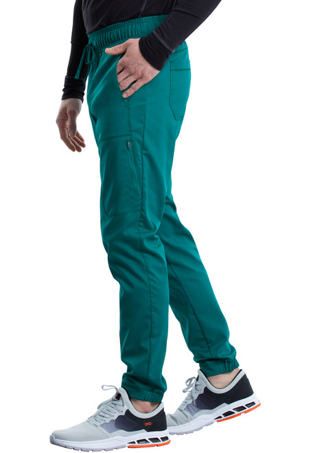 WW Revolution Tall Men's Jogger WW012T: Tapered fit, breathable fabric, 34" inseam. Features encased elastic waistband and multiple pockets. Ideal for long shifts, combining style and practicality in medical uniforms.
