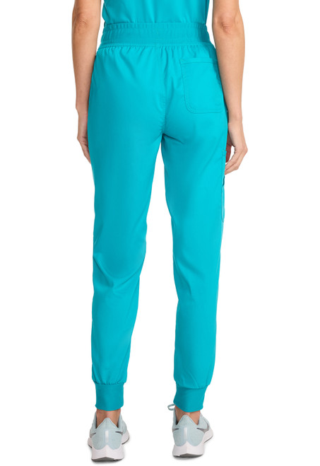 WW Revolution Tall Mid Rise Jogger WW115T: Mid-rise, pull-on scrubs with elastic waistband. Features multiple pockets and a tapered leg with knit cuffs for comfort and style. Ideal for healthcare professionals in demanding environments.