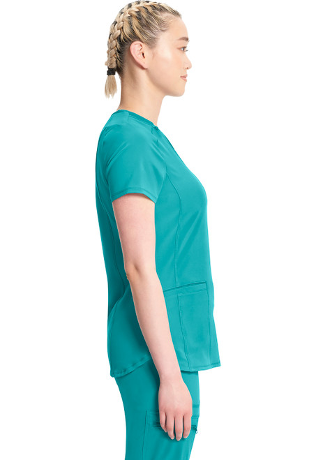 The Infinity V-Neck Top is a stylish medical uniform for nurses, made of 95% polyester and 5% spandex. It ensures comfort and flexibility. Featuring two pockets, it combines chic design with functionality, making it a perfect blend of form and utility.