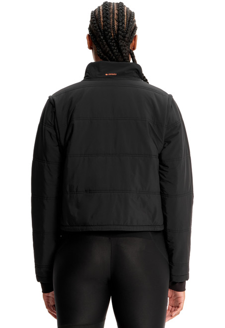 The Infinity GNR8 Zip Convertible Crop Quilted Jacket has snap-off sleeves for a vest option. With zip pockets and a bungee drawstring, it's perfect for medical uniforms, including nurse and medical scrubs.