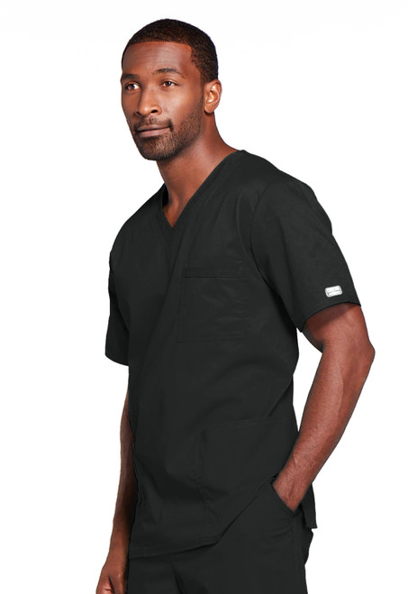 The WW Core Stretch Unisex V-Neck Top offers a stylish, functional medical uniform with a breathable blend. It features a traditional fit, double stitching, functional pockets, back yoke, side vents, and 28" length for optimal coverage.