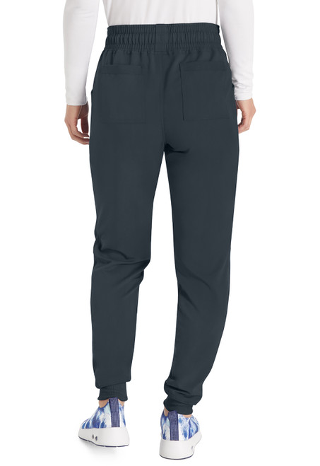 Back view of Balance Mid Rise Jogger Pant: elastic waistband, drawstring, rib-knit side panels, 2 back pockets. Stylish, comfortable, and ideal for nurse scrubs, offering a flattering fit and ease of movement.