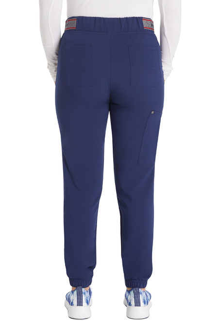The EDS NXT Petite Mid Rise Jogger offers a modern design for medical uniforms. With five pockets, an elastic drawstring waistband, and tapered legs, these scrubs provide comfort and style for healthcare professionals.