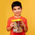 The Smart Saver Bank held by a smiling child