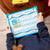 The Chore Chart from Financial Peace Kids, held by a child