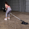T-Bar Rows with the Body-Solid Tools T-Bar Row Landmine Base with optional olympic bar, seated row bar and weights