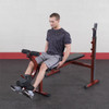 Leg Extensions on the Best Fitness Olympic Weight Bench