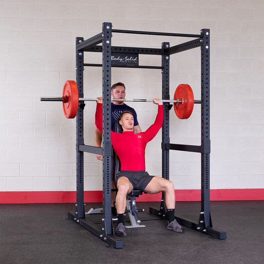 Shoulder Press on the Body-Solid SPR1000 Commercial Power Rack with optional bench