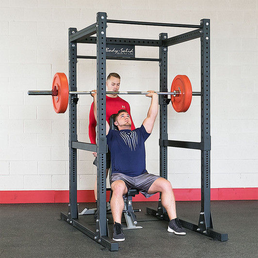 Shoulder Press on the Body-Solid SPR1000 Commercial Power Rack with optional bench