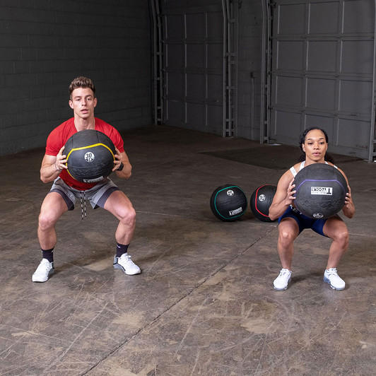 Squats with the Body-Solid Tools Heavy Rubber Balls