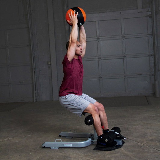 Squats on the Body-Solid Sissy Squat with optional medicine ball