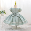 Discover the enchantment of our mint green dress for girls - a dreamy creation adorned with glossy satin, puffy sleeves, and delicate pearl trim. Featuring a charming bow in front and back, this dress is beautifully lined with soft cotton fabric for ultimate comfort