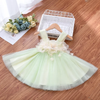 Discover the epitome of elegance with our enchanting green tulle dress featuring cascading 3D cream flower embellishments across the chest. Crafted with comfort in mind, this exquisite dress is luxuriously lined with soft cotton. Step into a world of beauty and grace today.