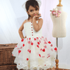 baby model wearing  white dress front view
