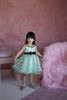 model wearing green dress