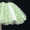 green daisy girls dress on mannequin skirt close up