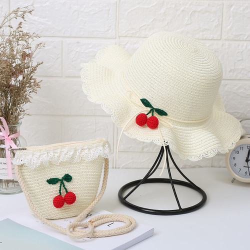 Cherry straw hat & bag set for kids on table Cherry straw hat & bag set for kids on table