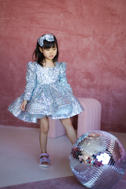 model wearing sequins dress