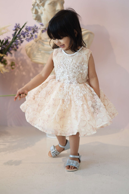 model wearing cream dress