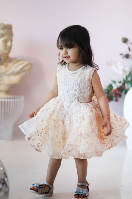 model wearing cream dress