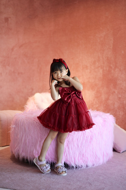 model wearing maroon dress