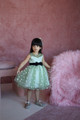 model wearing green dress
