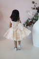 model wearing cream dress