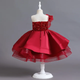 Looking for a captivating girls' dress? Our red dress boasts a sequin-adorned bodice and skirt, enhanced with horsehair braid to create a beautifully puffy silhouette. Designed with comfort in mind, it features a cotton lining for a soft feel against the skin. The tulle detail, starting from one shoulder and extending to the waist, adds a touch of elegance. Want a different hue? Check out the black version too! Perfect for those memorable events where style and charm take center stage.