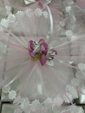 Close-up of delicate pink and white flowers, enhancing the charm of Italian wedding party decorations.