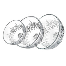 Three elegant glass bowls with floral designs, perfect for serving at weddings or special occasions. Three elegant glass bowls with floral designs, perfect for serving at weddings or special occasions.