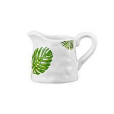 White ceramic creamer with palm leaves Design