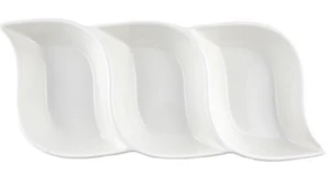 A trio of white porcelain bowls set against a white backdrop, ideal for wedding favors and charming table settings.