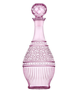 A beautiful pink glass decanter with intricate designs, perfect as a wedding or bridal shower favor