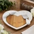 White ceramic heart cheese board with bamboo center and serving utensils, romantic wedding gift idea for special occasions