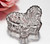 A clear glass butterfly-shaped box, perfect for wedding or bridal shower favors.