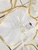 featuring white tulle and gold trim, ideal for party favors and decorations at Italian weddings.
