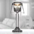 Elegant glass candle holder with a glowing candle inside, ideal for wedding favors and enhancing the ambiance