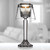 Elegant glass candle holder with a glowing candle inside, ideal for wedding favors and enhancing the ambiance