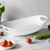 An image of an Italian white oval bowl with handles