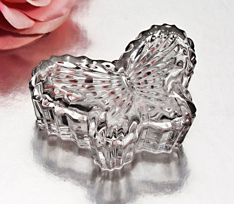 A clear glass butterfly-shaped box, perfect for wedding or bridal shower favors.