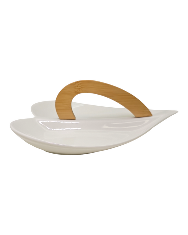 A white plate with a wooden handle, perfect for serving heart-shaped wedding favors at bridal showers